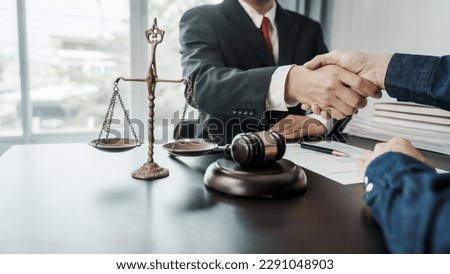 Shaking hands, Lawyers and clients discuss the rights and liberty of children and women. Royalty-Free Stock Photo #2291048903