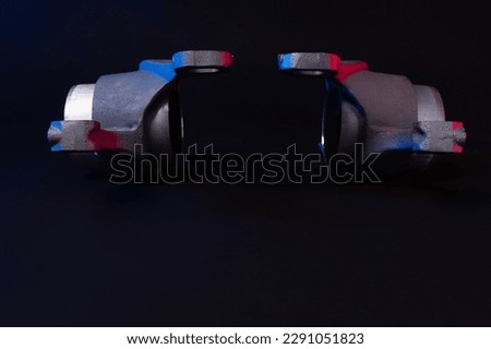 new car suspension detail, silent block on a black background