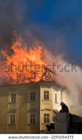 Close up of burning old city center. Royalty-Free Stock Photo #2291054375