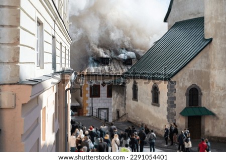 Close up of burning old city center. Royalty-Free Stock Photo #2291054401