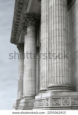 Fragment of the facade of the building with white columns