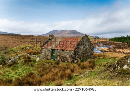 An old cottage with a rusty roof at Maam Cross in Connemara national park in Galway on the west coast of Ireland Royalty-Free Stock Photo #2291064985
