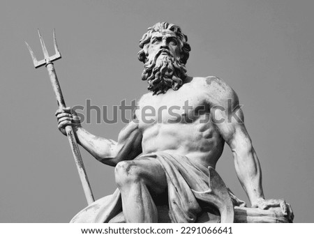 Ancient stone statue of mighty god of the sea and oceans Neptune (Poseidon) with trident. Black and white image. Royalty-Free Stock Photo #2291066641