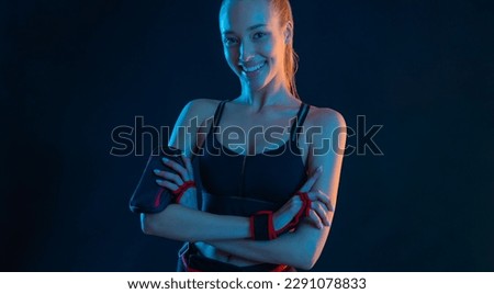 Fit woman influencer at gym. Picture for advertising a fitness club in social networks. Workout for women at home. Cover for sport motivation music. Runner concept. High resolution wallpaper