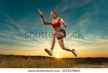 Runner concept. Woman athlete running on the trail. Fitness and sport motivation. Sprinter run. Download photo for advertising a fitness club in social networks. Cover for sport motivation music.