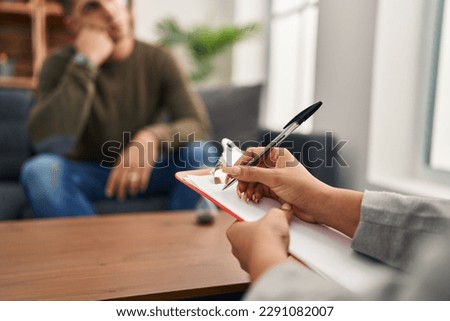 Man and woman having psychology session at clinic Royalty-Free Stock Photo #2291082007