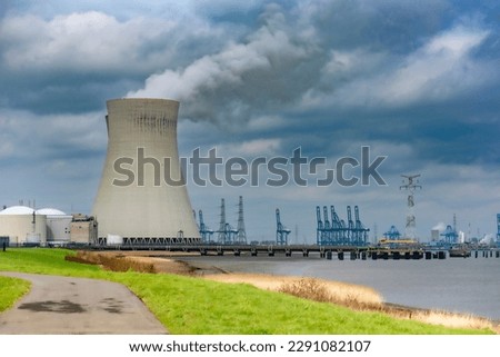 Cooling tower of a nuclear plant near a river Royalty-Free Stock Photo #2291082107