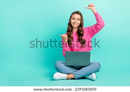 Full length photo of dreamy sweet lady dressed knitted pullover texting device thumbs empty space isolated teal color background