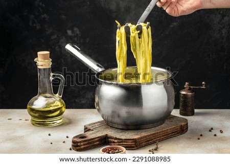 Closeup of boiling spaghetti pasta. put salt and olive oil inside water in the pot. Royalty-Free Stock Photo #2291088985
