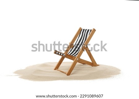 Deck chair on sand isolated on white background