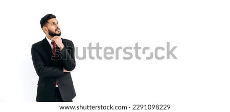 Copy-space for your presentation. Panoramic photo of puzzled thoughtful elegant arabian or indian man in suit, stand on isolated white background, pensively looking away, thinking, planning, dreaming