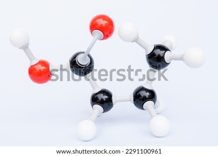 Butanoic acid is an oily colourless liquid with the chemical formula C4H8O2. It is a short chain saturated fatty acid found in the form of esters in animal fats and plant oils. Chemistry molecule mode Royalty-Free Stock Photo #2291100961