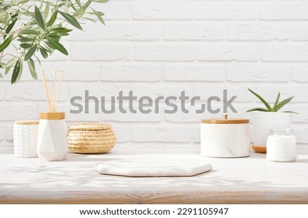 Empty marble podium on bathroom table before white brick wall Royalty-Free Stock Photo #2291105947