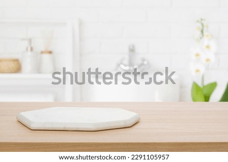 Marble podium for bathing product display on blurred bathroom background Royalty-Free Stock Photo #2291105957