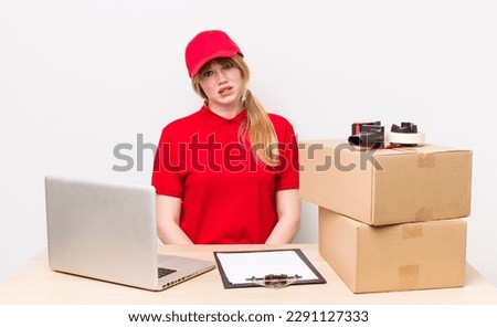 red head pretty woman feeling puzzled and confused. employee concept