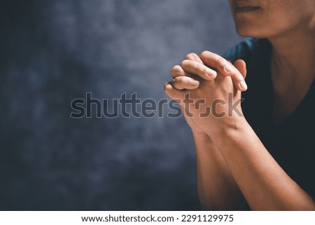 Hands folded in prayer on a Holy Bible in church concept for faith, spirituality and religion, woman praying on holy bible in the morning. woman hand with Bible praying. Royalty-Free Stock Photo #2291129975