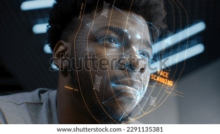Face portrait of young African American man with focused look. 3D animation of human futuristic AI biometric face recognition system. Identification for access. Privacy and modern scanning technology.