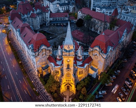 Aerial view of the Piarist church-chapel and their high school complex. Photo was taken on the 17th of April 2023 in Timisoara, the European Cultural Capital of 2023, Timis County, Romania. Royalty-Free Stock Photo #2291172741