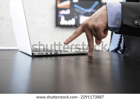 Close-up photo of male hand typing on keyboard in the office