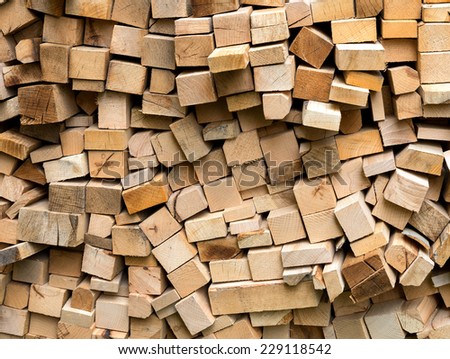 Pile of fresh cut wood logs ready for winter