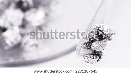 metal spatula with chromium ore, industrial use ore, metallic chemical element, isolated on white background
