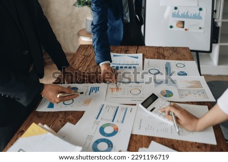 Asian business advisor meeting to analyze and discuss the situation on the financial report in the meeting room.Investment Consultant, Financial , teamwork ,brainstorming ,startup and accounting.
