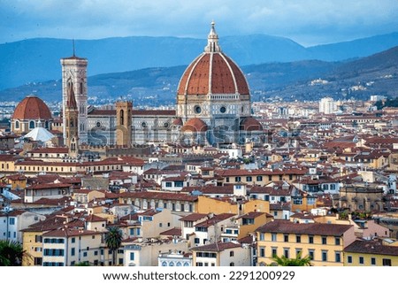 Breathtaking panorama of Florence (Firenze) at golden sunset from Piazzale Michelangelo. The Duomo, Palazzo Vecchio and other Renaissance landmarks bask in warm evening light Royalty-Free Stock Photo #2291200929