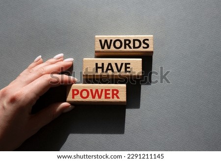 Words have power symbol. Wooden blocks with words Words have power. Beautiful grey background. Businessman hand. Business and Words have power concept. Copy space.