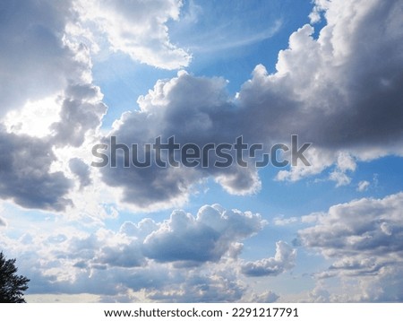 a blue sky with clouds and sunshine