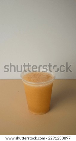 Apple juice in a blank template plastic cup, space for copy and brand logo, or coffee shop, image for menu