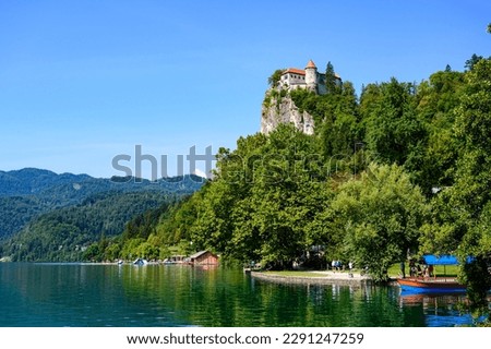Beautiful idyllic view on island, castle, catholic Maria church in lake Bled.  Slovenia.