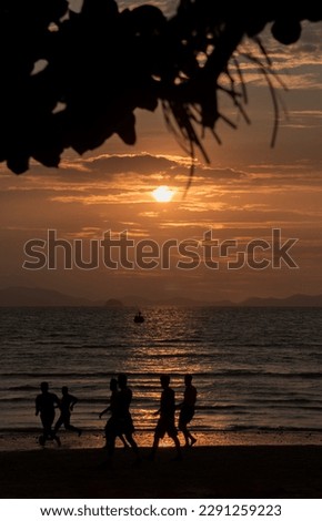 Playing football before sunset at Railay beach, Krabi, Thailand. 
