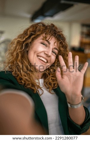 One woman caucasian female happy confident stand indoor at cafe with curly hair smile real person copy space self portrait selfie UGC User Generated Content Royalty-Free Stock Photo #2291280077