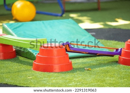 Bright play equipment in kindergarten yard with no people Royalty-Free Stock Photo #2291319063
