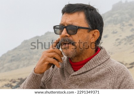 Man communicating by cell phone