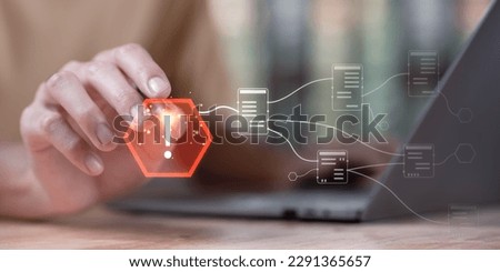 Programmer and virtual icons , exclamation mark ,alarm,computer virus detected ,danger warning concept or information error that should be urgently fixed and repaired ,Notification of security issues  Royalty-Free Stock Photo #2291365657