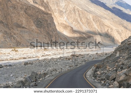 beautiful photo of the road going through the mountains and blue sky at Turtuk village, Nubra Valley, Ladakh, India.