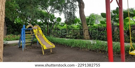 Child slide green city park surabaya