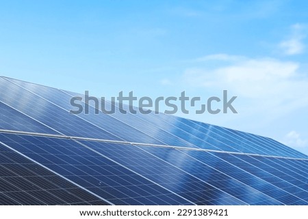 Solar cell panels with a sky background. Alternative electricity source Royalty-Free Stock Photo #2291389421
