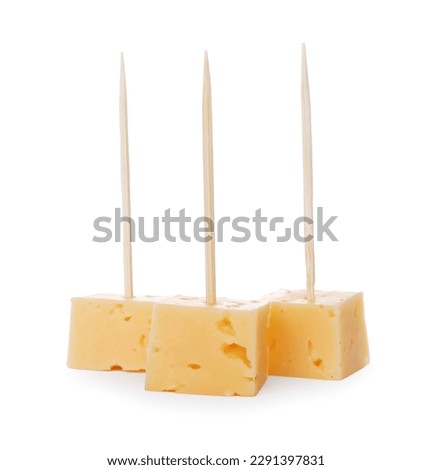 Toothpick appetizers. Tasty cheese pieces on white background Royalty-Free Stock Photo #2291397831
