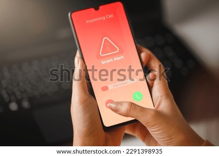 Scam incoming call alert screen on mobile phone. Phone fraud prevention concept. Royalty-Free Stock Photo #2291398935