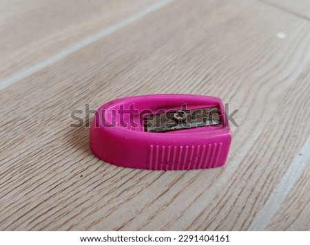 pink pencil sharpener that is rusty and not sharp Royalty-Free Stock Photo #2291404161