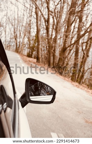 Travelling in camper van with family and friends. Holidays in nature on a beautiful scenic trail holidays and leisure travel ideas. Road with asphalt road on an autumn day in the park.