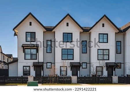 New residential townhouses. Modern apartment buildings in Canada. Modern complex of apartment buildings. Concept of real estate development, house for sale and housing market Royalty-Free Stock Photo #2291422221