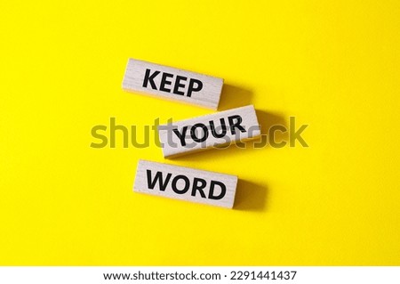 Keep your word symbol. Wooden blocks with words Keep your word. Beautiful yellow background. Business and Keep your word concept. Copy space.