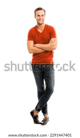 Full body, growth length portrait image of happy smiling handsome man with folded hands, wear in orange color t-shirt, casual cloth, denim jeans, isolated white background. Fashion concept ad. Royalty-Free Stock Photo #2291447401