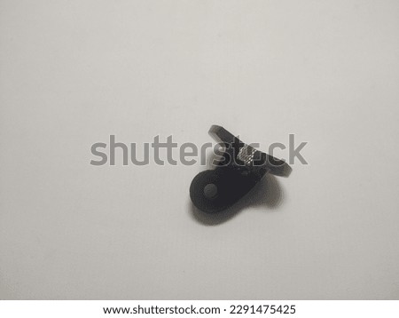 adapter connecting action camera with tripod, destroyed, split, black in color, destroyed by a fall from a height of 5 meters, white background