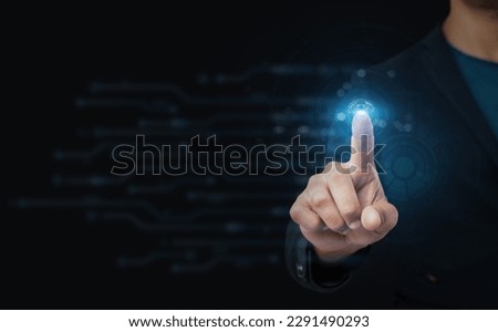 A businessman's hand is pointing at a fuzzy blue background with an abstract glowing polygonal sphere and a digital business interface. Concept of the future, innovation, and technology.