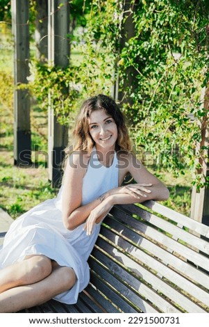 woman sitting on park bench rest walk