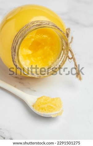 Ghee or clarified butter. cooking oil, pure ghee. Healthy fat diet concept. banner, menu, recipe place for text, top view. Royalty-Free Stock Photo #2291501275